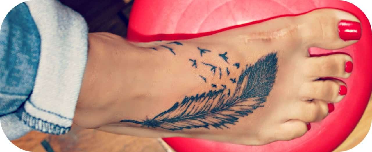 black-ink-feather-with-flying-birds-tattoo-on-girl-right-foot